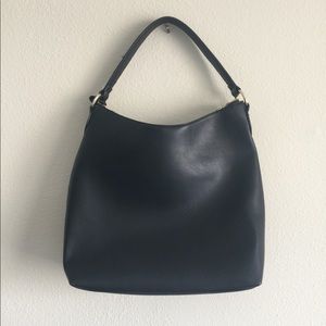 Black faux leather and synthetic suede carry-all
